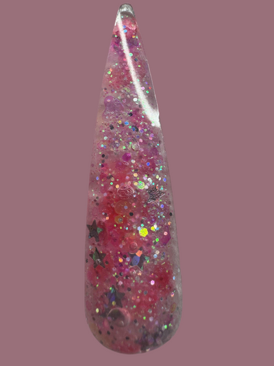Glitter acrylic powders with multicolored sparkles and star shapes.