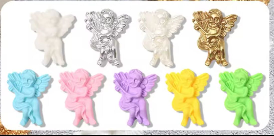 Nail Charms Pastel cherubs angel nail charms in various soft and metallic colors.