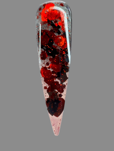 Halloween themed red and black glitter acrylic nail powder on a pointed nail tip