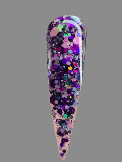 Halloween themed nail glitter acrylic powder with purple and multicolor sparkles on display nail tip
