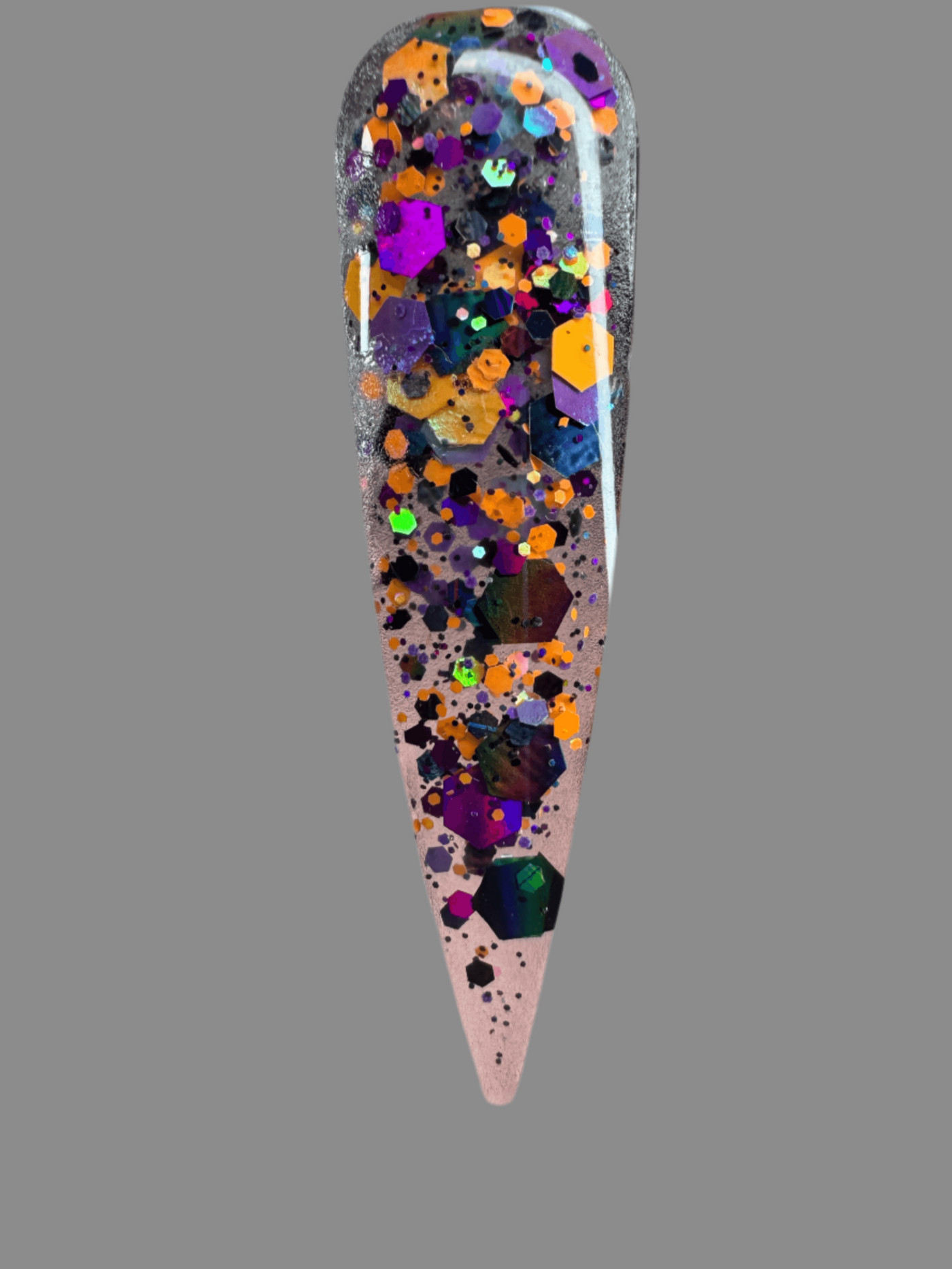 Halloween themed nail glitter acrylic powder with orange, purple, and black hexagonal glitter pieces on a clear base