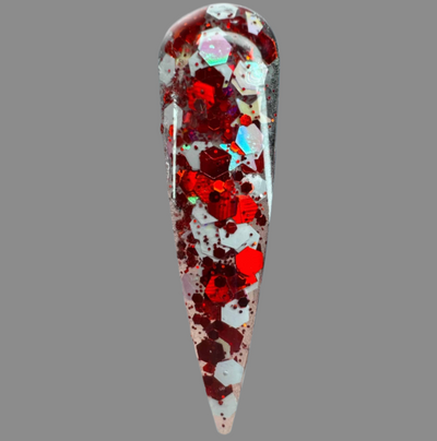 Halloween themed red and white glitter acrylic nail powder on a nail tip